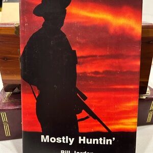 Mostly Huntin' Book with Red and Black Cover